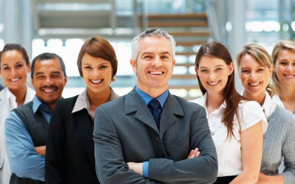 A large team standing together for a group portrait.